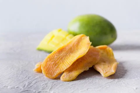 Dehydrated and dried mango chips. Close up. Stock Photos
