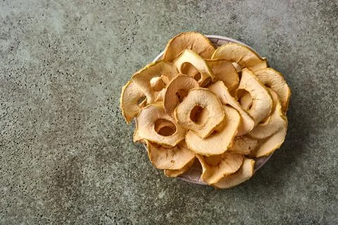 Dehydrated apples chips top view Stock Photos