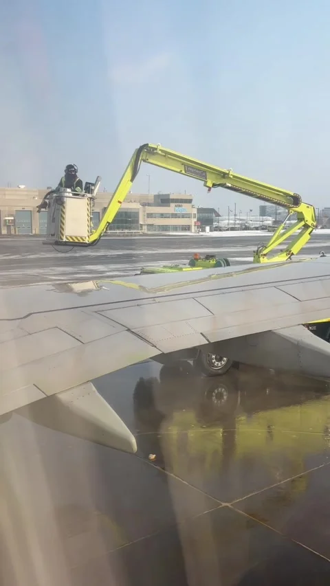 Deicing Agent spraying an airplane wing Stock-Footage 330138803