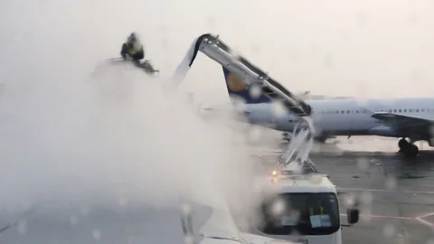 Deicing an Airplane, Viewed from a Passenger Window 3 Stock Footage 78365133
