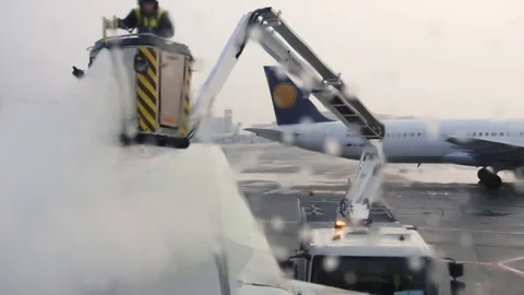 Deicing an Airplane, Viewed from a Passenger Window 4 Stock Footage 78365233