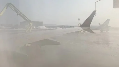 Deicing an airplane wing Stock Footage 330138805