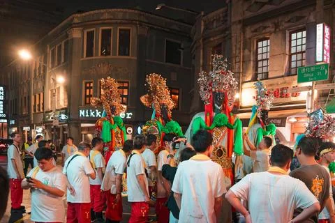 Deity Palanquin Parked as Staff Take Break During Night Parade Stock Photos