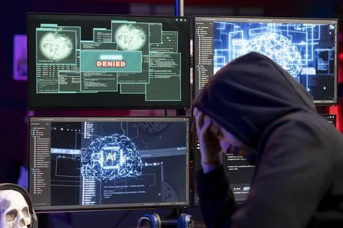 Dejected hacker upset after getting access denied message on PC Stock Photos