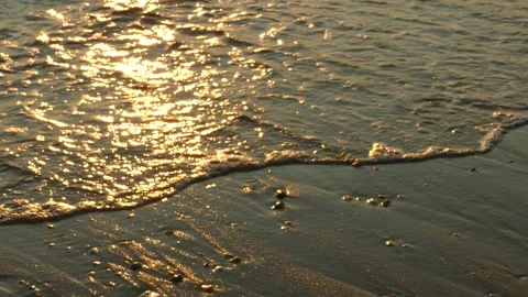 Delaware Bay waves on pebbled beach at sunrise; CU, 4K Stock Footage 139018676