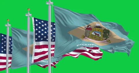 Delaware state flag waving with the US flag isolated on green background Stock Footage 327027314