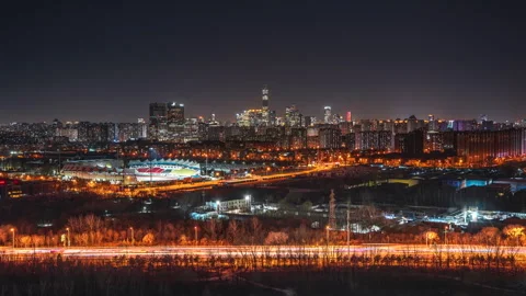 Delayed night view of Guomao area from Chaoyang Sports Center, Beijing, China Stock Footage 300118701
