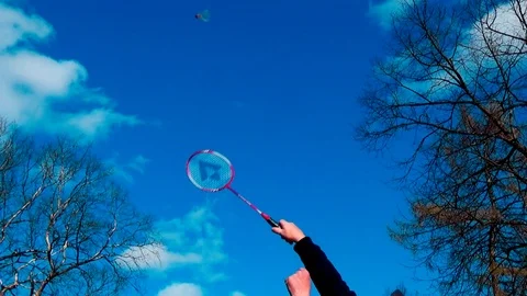 Delayed punch racket in the shuttle when serving in the game badminton Stock Footage 75559392