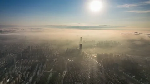 Delayed sunrise in Chinese cities Stock Footage 233675343