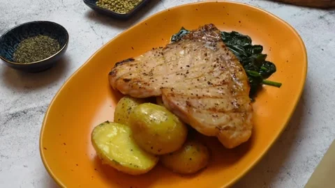 Delectable Fish Steak on Yellow Plate, Marble Table: Close-Up, Irresistible.. Stock Footage 239109170