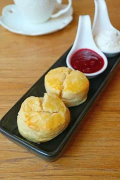 Delectable Scones with Raspberry Jam and Whipped Cream Stock Photos
