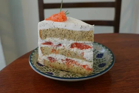 A delectable slice of cake with rich layers of cream and frosting, topped w.. Stock Photos