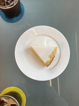 A delectable slice of cake with rich layers of cream and frosting, topped w.. Stock Photos