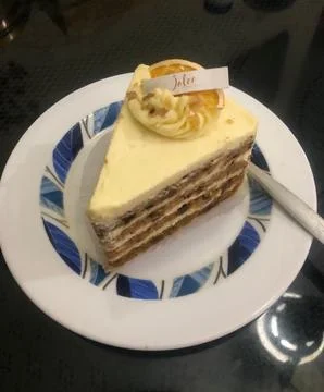 A delectable slice of cake with rich layers of cream and frosting, topped w.. 写真素材