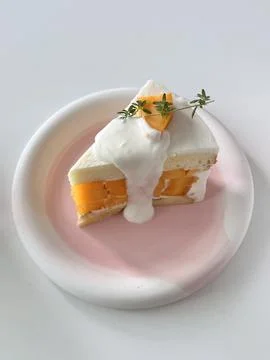 A delectable slice of cake with rich layers of cream and frosting, topped w.. Stock Photos