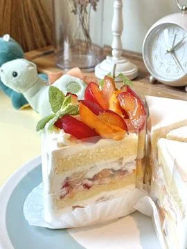 A delectable slice of cake with rich layers of cream and frosting, topped w.. 写真素材