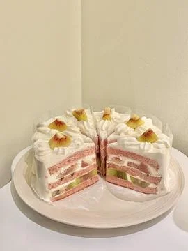 A delectable slice of cake with rich layers of cream and frosting, topped w.. Stock Photos