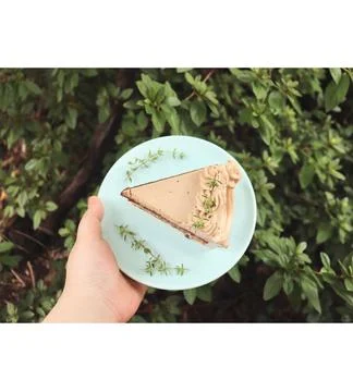 A delectable slice of cake with rich layers of cream and frosting, topped w.. 写真素材