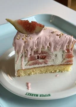 A delectable slice of cake with rich layers of cream and frosting, topped w.. 写真素材