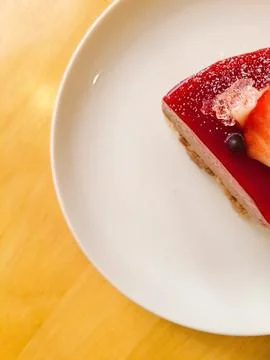 A delectable slice of cake with rich layers of cream and frosting, topped w.. Stock Photos