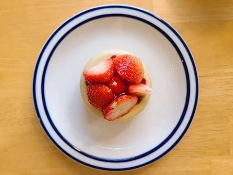 A delectable slice of cake with rich layers of cream and frosting, topped w.. Stock Photos