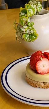 A delectable slice of cake with rich layers of cream and frosting, topped w.. Stock Photos