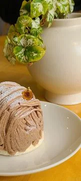 A delectable slice of cake with rich layers of cream and frosting, topped w.. Stock Photos