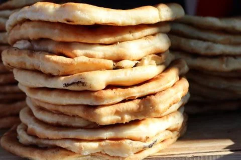 A Delectable Stack of Fried Flatbreads That Will Tempt Your Taste Buds and Stock Photos