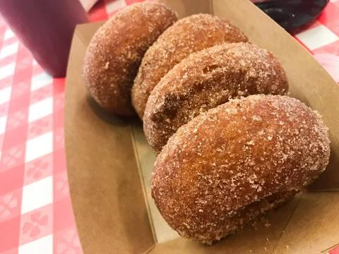 Delectable Sugar-Dusted Donuts: A Close-Up Delight Stock Photos