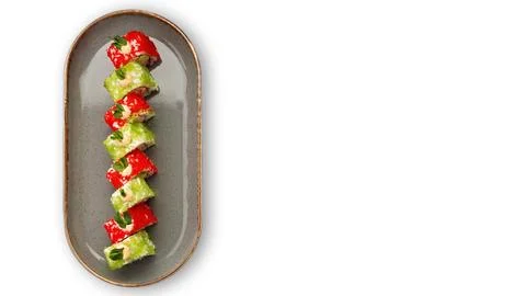 Delectable sushi roll topped with delicate flying fish roe Stock Photos