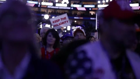 A delegate holds a 'Keep the Majority' sign amid the crowd, RNC Dallas 2026 Stock Footage 345274885