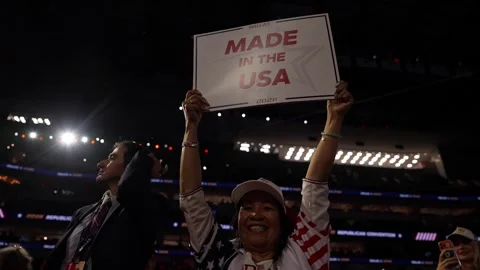 A delegate raises a 'Made in the USA' sign, RNC Dallas 2026 Stock-Footage 345274994