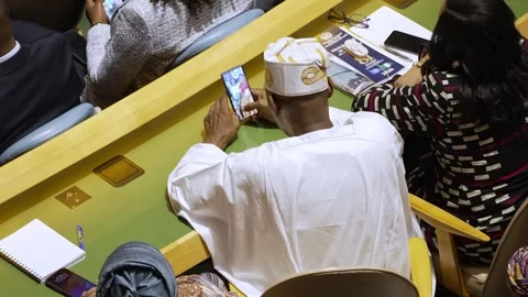 Delegate uses phone in UN General Assembly Hall Stock-Footage 346265182
