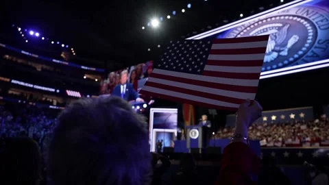 A delegate waves an American flag as President Donald Trump speaks Stock Footage 345274225