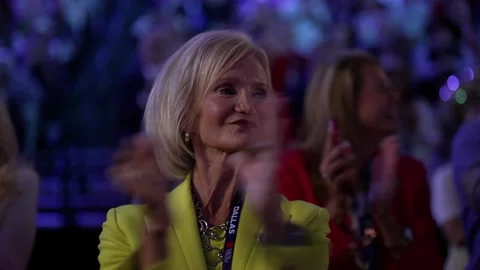 A delegate in a yellow jacket smiles and applauds, RNC Dallas 2026 스톡 동영상 345274965
