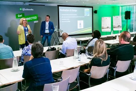 Delegates attending a break-away session at accountancy conference in Fotos Stock