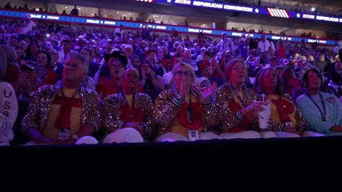 Delegates in sequined outfits cheer in the stands, RNC Dallas 2026 Stock Footage 345271371