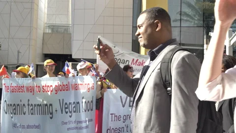 Delegates taking picture of vegan activist Stock Footage 269682897