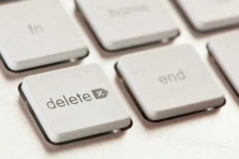Delete button on a white and grey computer keyboard Stock Photos