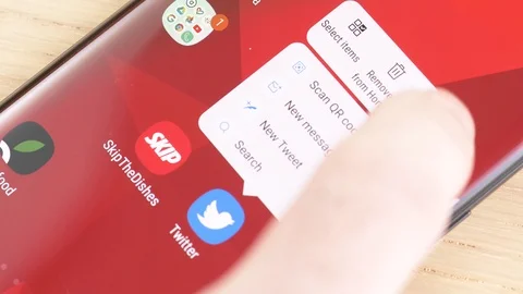 Deleting Twitter App on a Smartphone Screen Stock Footage 107158742