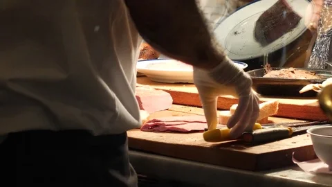 Deli worker prepares a sandwich 스톡 동영상 82706948