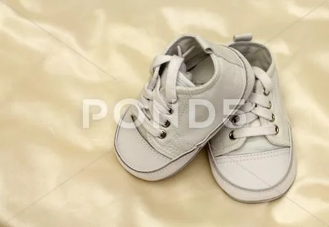 Delicate baby shoes Stock Photos