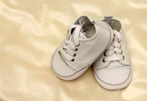 Delicate baby shoes Stock Photos