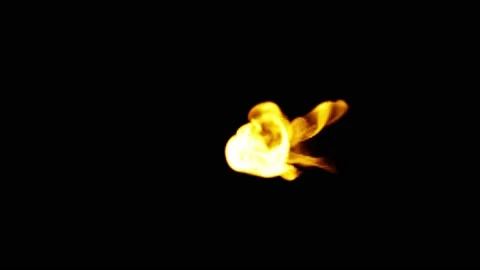 A delicate blob of fire pours in from the side of the screen. A small cloud o Stock Footage 151860076