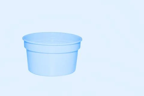 Delicate blue light plastic jar capacity of isolated on pale blue Stock Photos