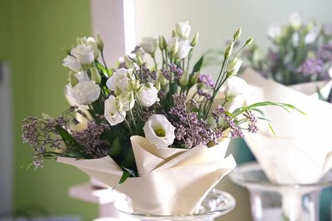 A delicate bouquet of eustoma (also known as lisianthus or Irish rose) in l.. Stock Photos