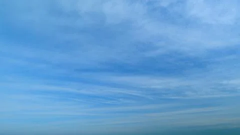 Delicate cirrus clouds in sky in august. Natural background texture taken on Stockfoto's