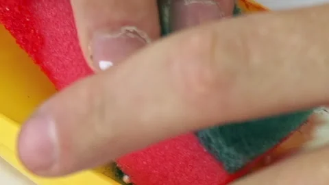 Delicate Cleansing a Sponge Sweeping Green on Yellow Video stock 340594231