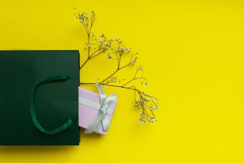 Delicate composition with gift pink box with a gray bow Stock Photos