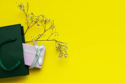 Delicate composition with gift pink box with a gray bow Stock Photos